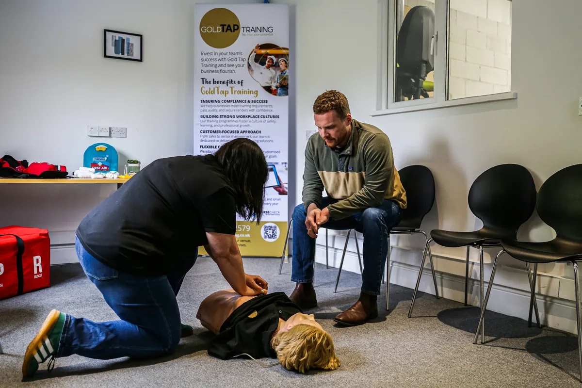 A practical first-aid training session being photographed